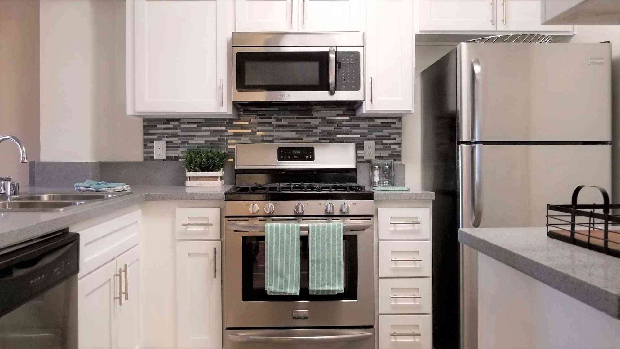 kitchen appliances and white cabinetry