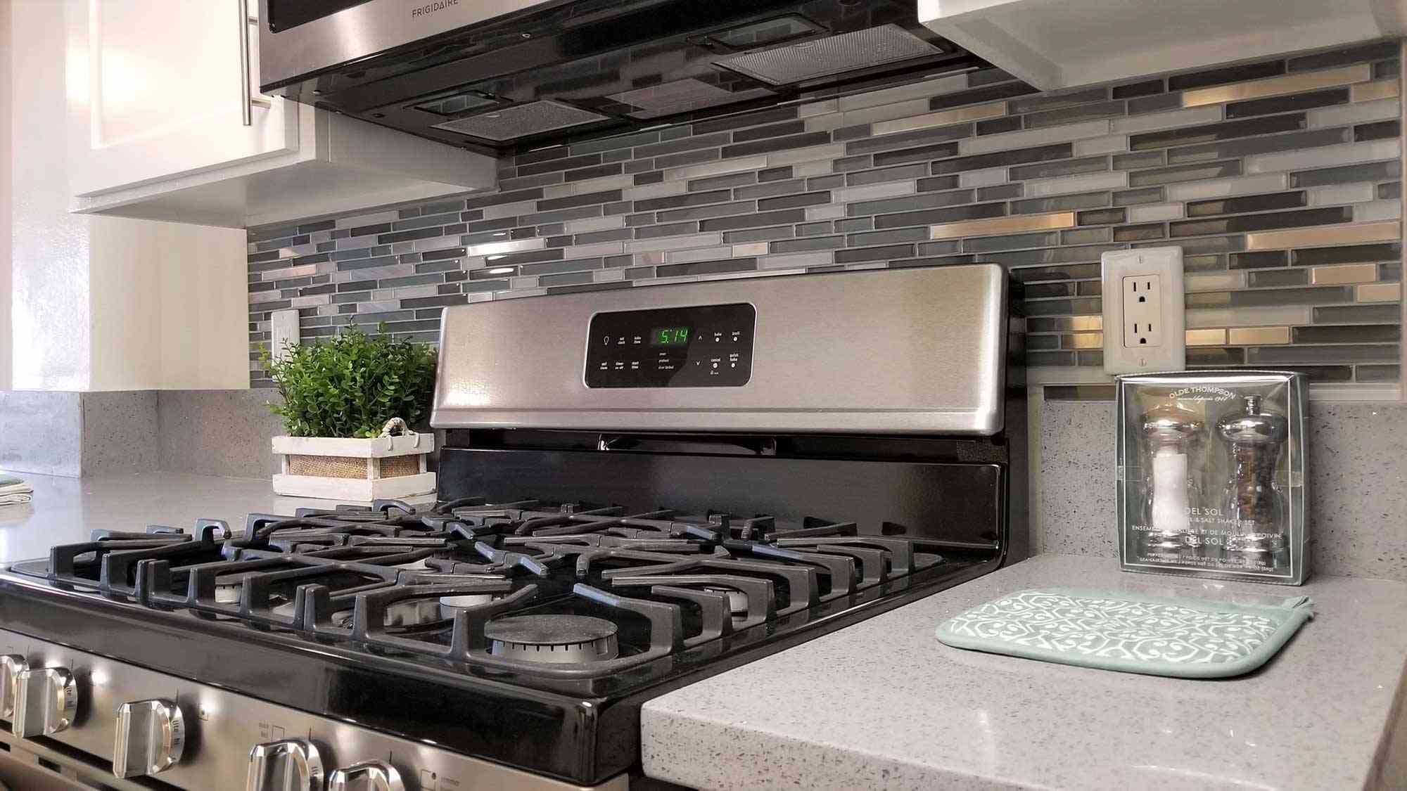 gas stove and tile backsplash detail