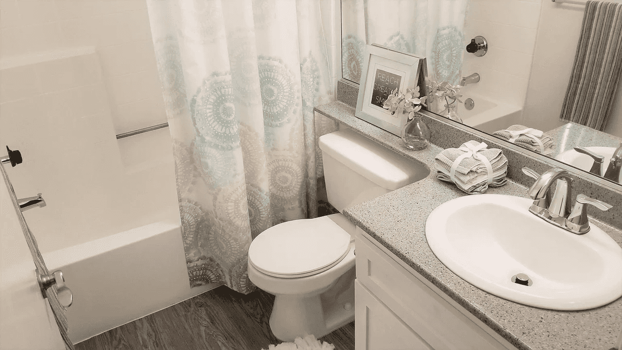 full bathroom with tub shower combo and updated fixtures
